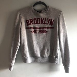 Grey and red sweatshirt
